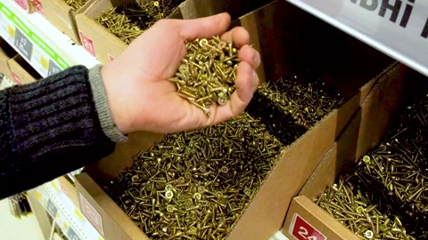 Choose self-tapping screws in the store. selective focus. Stock Footage 148319286