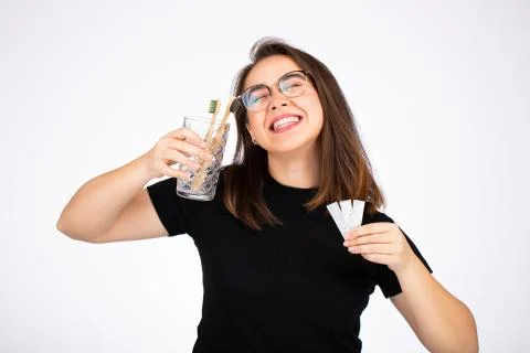 Choosing between brushing your teeth and chewing gum concept. Woman offering to Stock Photos