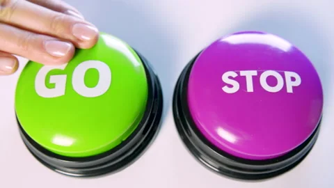 Choosing between Go and Stop button. Turn on or off. Pause or start an action. Stock Footage 145912526