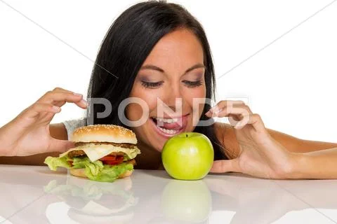 Choosing between hamburger and apple Stock Photos