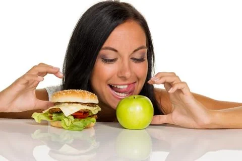 Choosing between hamburger and apple Stock Photos