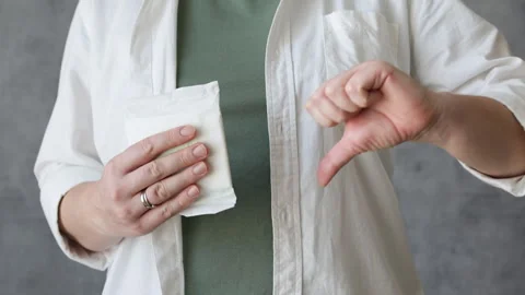 Choosing between pad and menstrual cup. Stock Footage 302790054