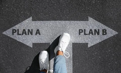 Choosing between Plan A and Plan B. Woman near pointers on road, above view Stock Photos