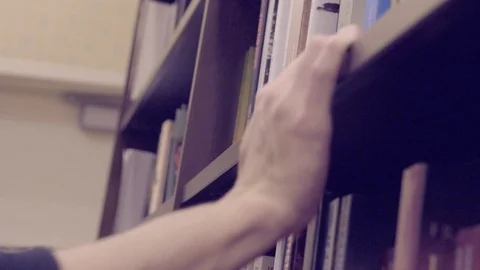 CHOOSING A BOOK Stock Footage 86082806