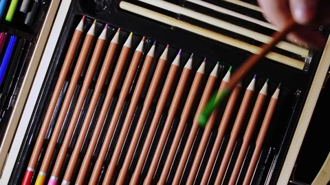 Choosing colored pencils for drawing Stock Footage 303835349