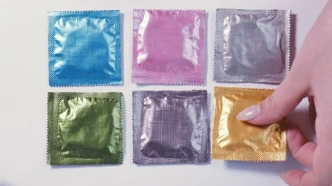 Choosing a condom Stock Footage 173617015