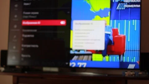 Choosing correct settings for TV set, tuning channels Stock Footage 129868633