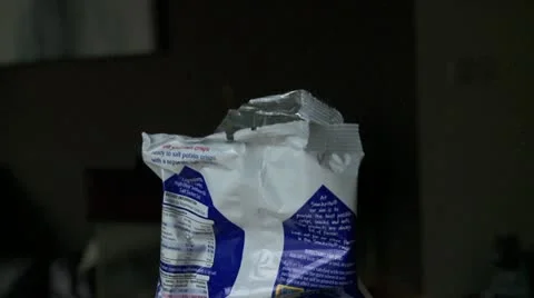 Choosing crisps or potato chips from a bag Stock Footage 11016370