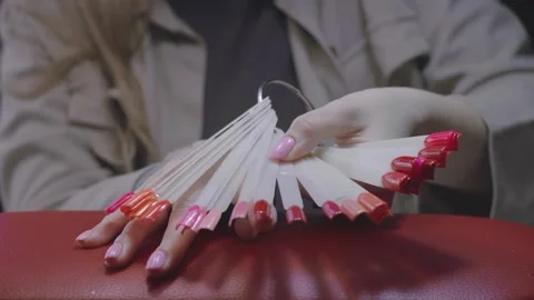 Choosing nail colours Stock Footage 267751938