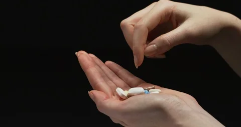 Choosing a pill Stock Footage 99750543