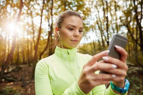 Choosing playlist for jogging Stock Photos
