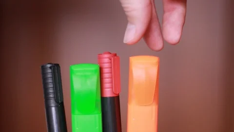 Choosing red marker closeup Stock Footage 100820525