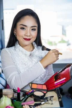 Choosing the size of the make up. Stock Photos