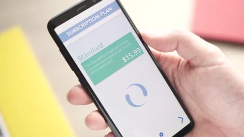 Choosing a Subscription Plan on a Smartphone App Closeup Stock Footage 227025732