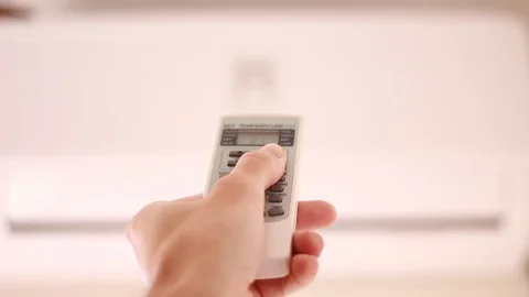 Choosing temperature on air conditioner Stock Footage 95319020