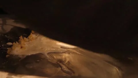 Chop and Mix Process of Making Stir-Fried Rolled Ice Cream on a Frozen Pan Close Stock Footage 345292986