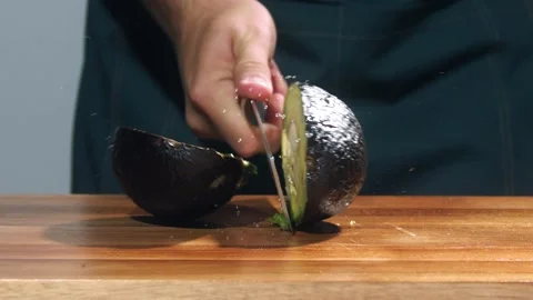 Chop the  avocado slow motion Stock Footage 237886728