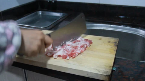Chop up the pork for potato pie Video stock 37042948