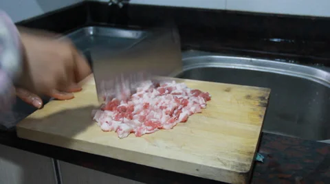 Chop up the pork for potato pie Video stock 37043930