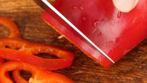 Chop the red pepper slices Stock Footage 84478791