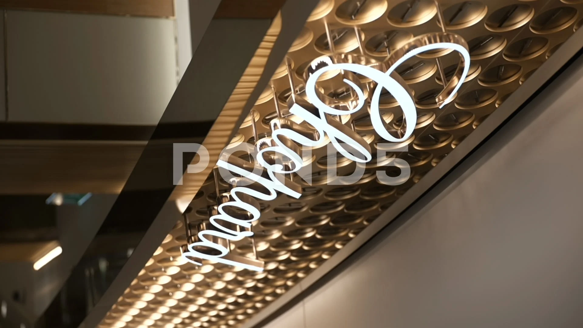 Chopard prestigious watch brand glowing logo sign inside luxury watch shop