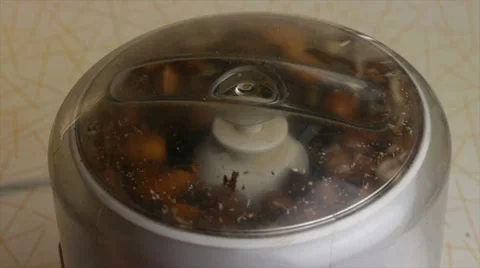 Chopped almonds and hazelnuts in a blender. Slow motions picture. Stock Footage 33941778