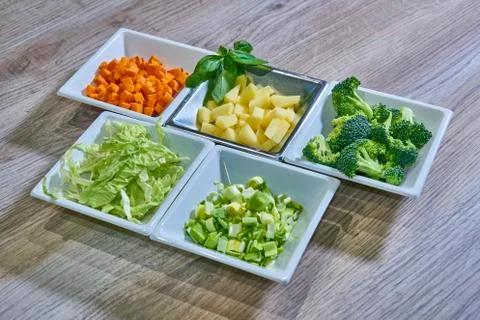Chopped and ordered vegetables to start cooking Photos
