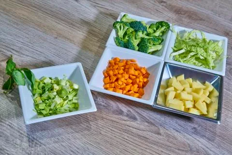 Chopped and ordered vegetables to start cooking Photos