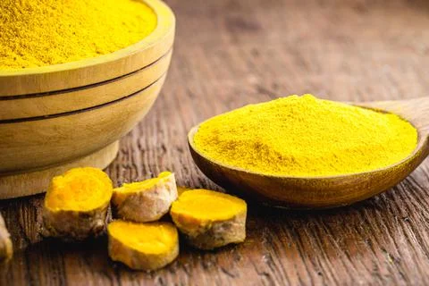 Chopped and powdered saffron on a table. Spicy culinary ingredient Stock Photos