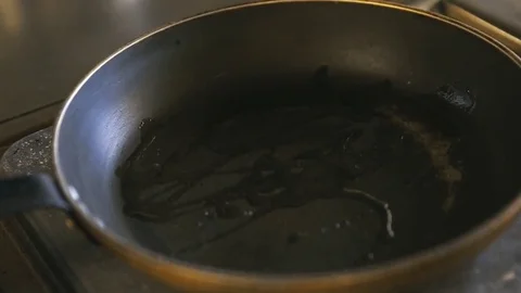 Chopped bacon falls on a hot pan Stock Footage 77481003