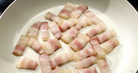 Chopped bacon, pancetta fried in a pan. top view. cooking pasta carbonara. Stock Footage 245359393
