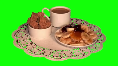 Chopped bananas with jam, cane sugar, white coffee on paper napkin Stock-Footage 48466232