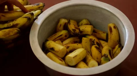 Chopped bananas in vessel Stock Footage 49009375