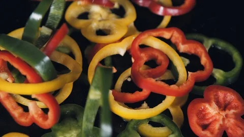 Chopped bell pepper falls on the black table. Stock Footage 113041284