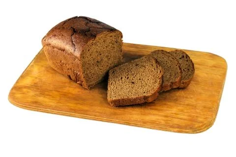 Chopped brown bread on a board Foto stock