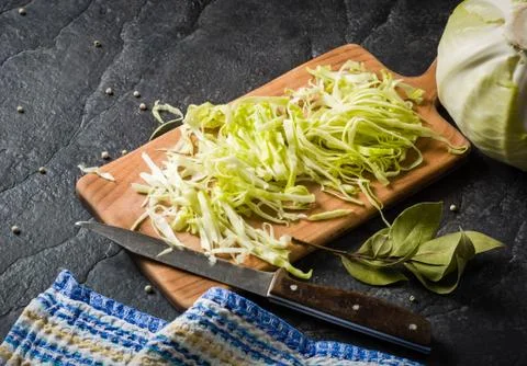 Chopped cabbage on a black stone background Stock Photos