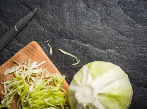 Chopped cabbage on a black stone background Stock-Fotos