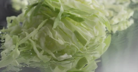 Chopped cabbage falls on a mirror surface Video stock 205213438