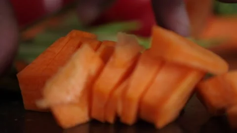 Chopped carrots with a kitchen knife 스톡 동영상 137211270