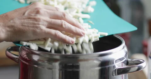 Chopped celery root poured into pot Stock Footage 170448647