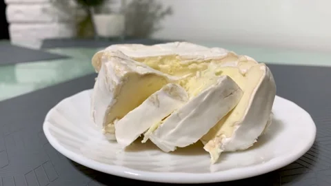 Chopped cheese on a white plate, kitchen table, gray placemat. Close-up 스톡 동영상 152855463