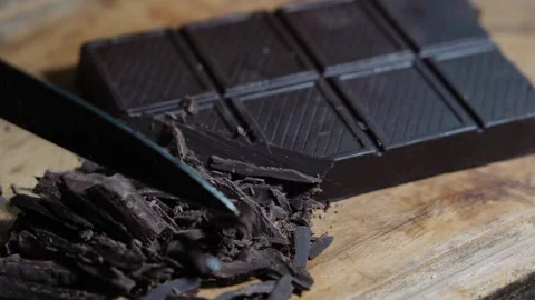 Chopped chocolate bar with a knife Stock Footage 287681179