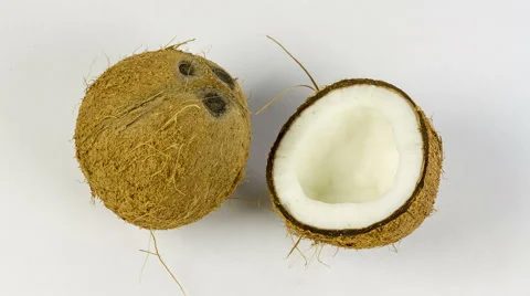 Chopped coconut close up rotation on white background Stock Footage 53754988