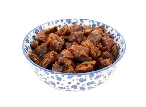 Chopped dates in a blue and white china bowl Stock Photos