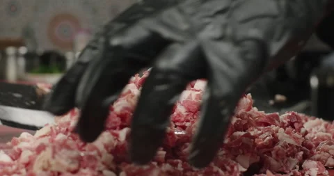 Chopped fat meat on the cutting board. Chef prepares raw meat with fat with a Stock Footage 275651734