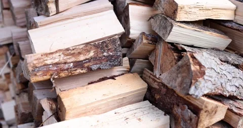 Chopped firewood stack prepared in village house yard Vídeo Stock 237011745