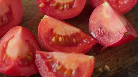 Chopped fresh ripe tomato vegetable on wooden cutting board. Cooking vegetable Video stock 251014716