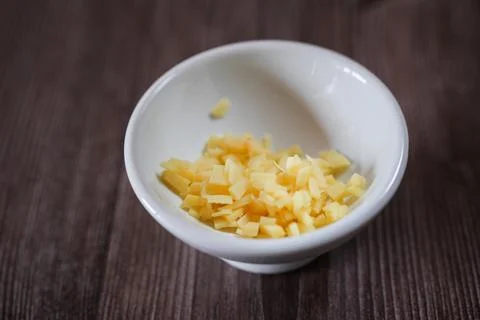 Chopped Ginger Pieces on Clean Surface Highlighting Culinary and Health Con.. Stock Photos
