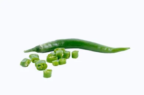 Chopped green chilli on white background Stock Photos