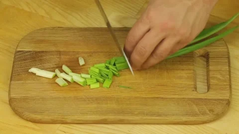 Chopped green onions with a sharp knife Stock Footage 192087933